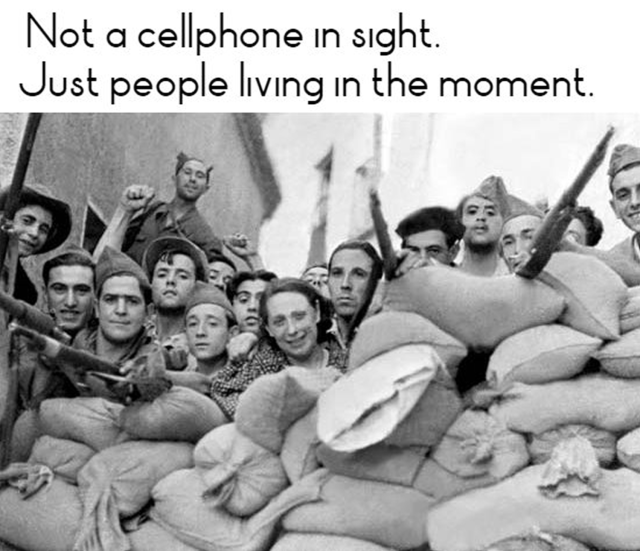 Not a cellphone in sight. Just people living in the moment – which us the barricades of Barcelona in 1936.